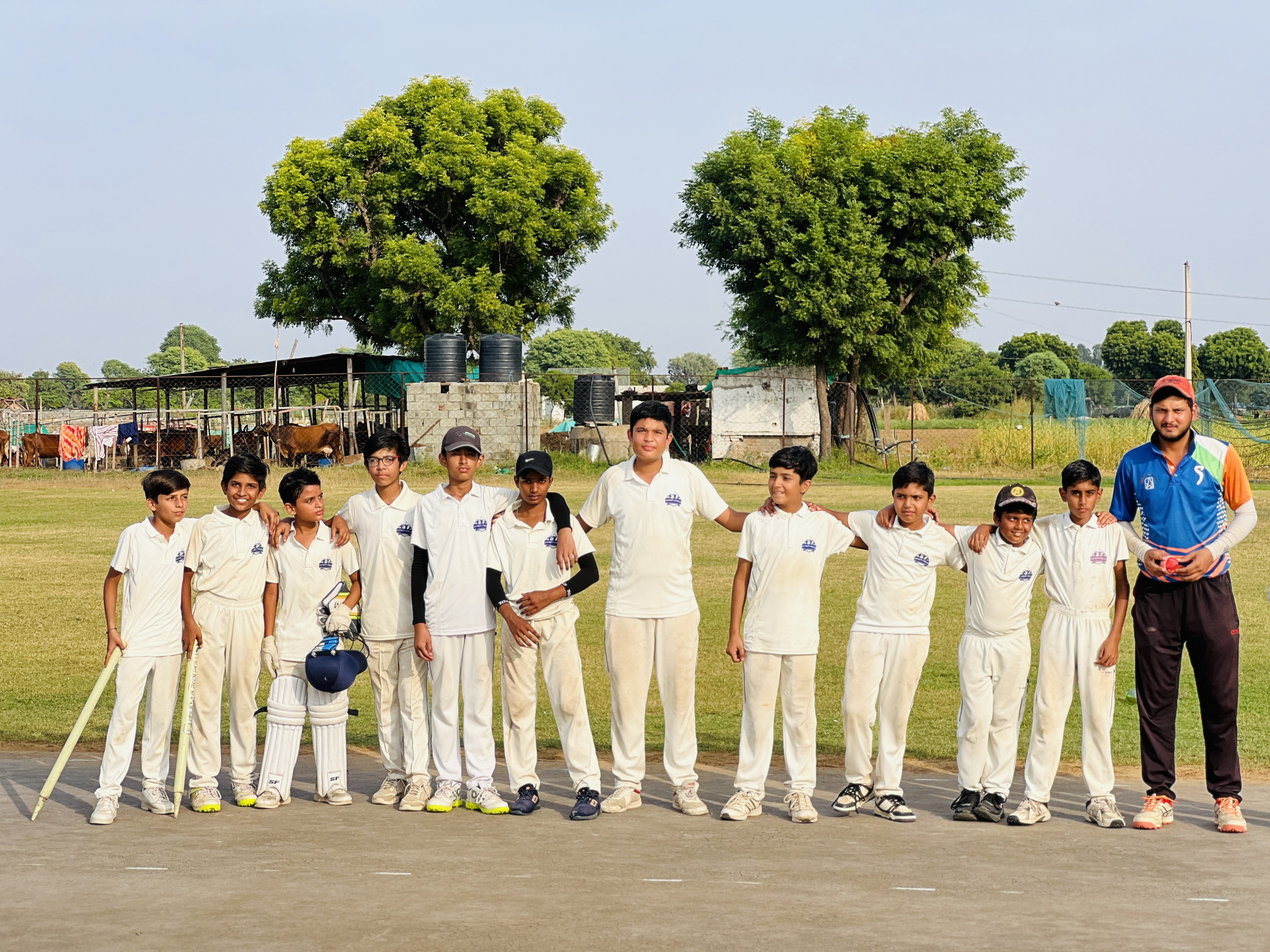Jankinandan Academy cricket squad with coach